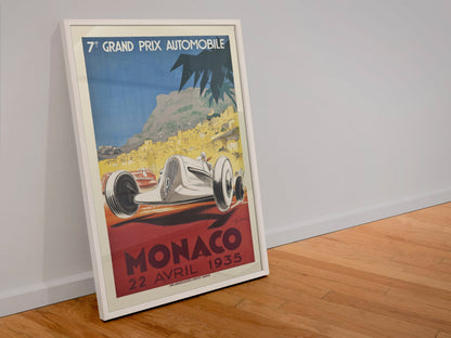 Monaco Grand Prix 1935 poster in a white frame leaning against a wall