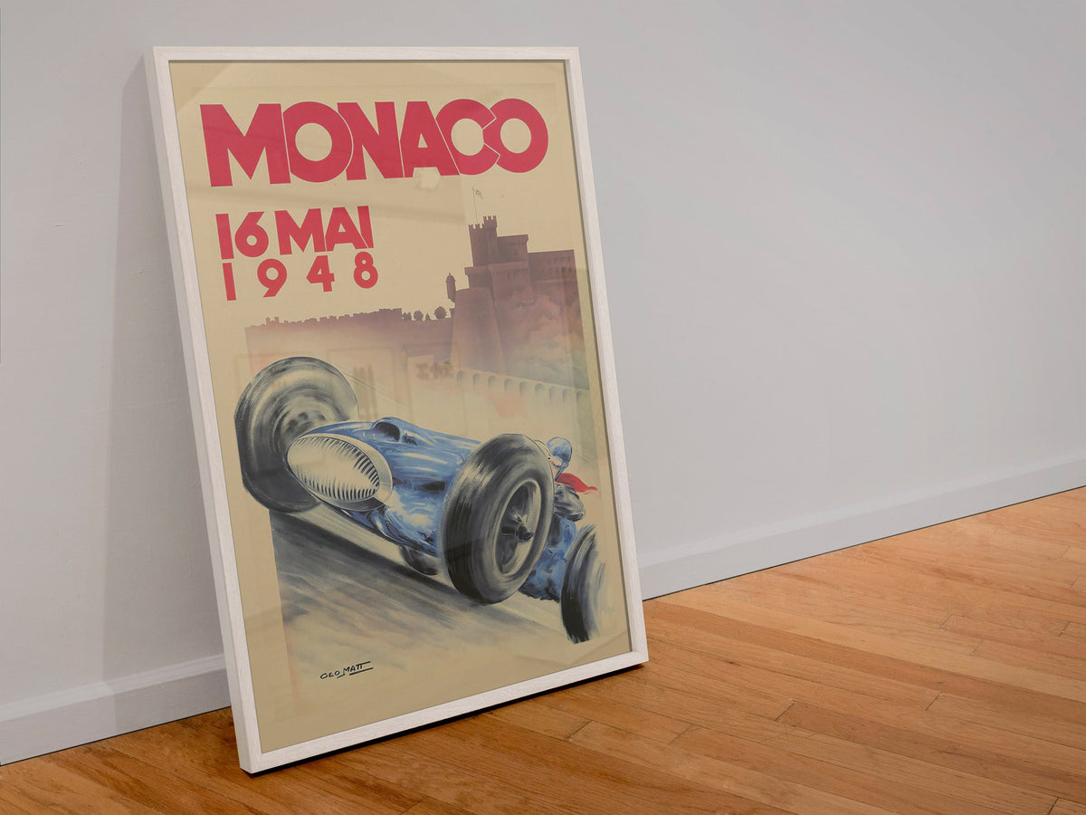 Monaco Grand Prix 1948 poster in a white frame leaning against a wall