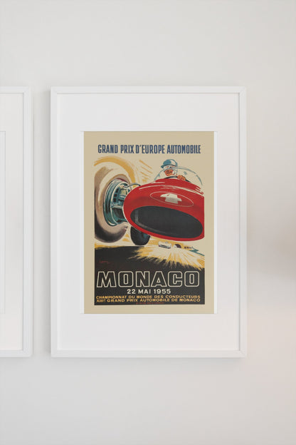 Monaco Grand Prix 1955 poster in a white frame on a light wall