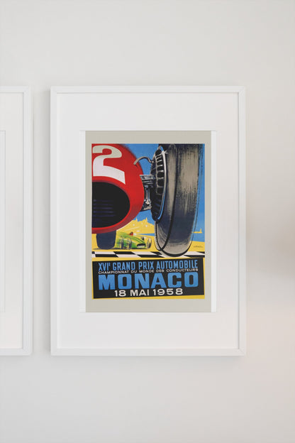 Monaco Grand Prix 1958 poster in a white frame on a light wall