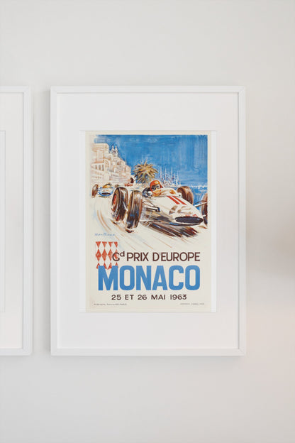 Monaco Grand Prix 1963 poster in a white frame on a light wall