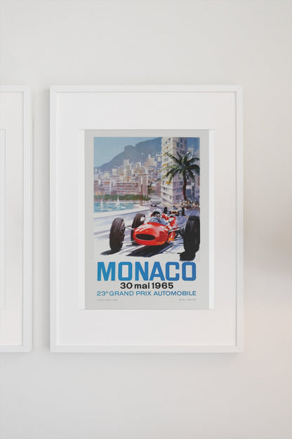 Monaco Grand Prix 1965 poster in a white frame on a light wall