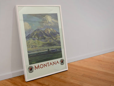 Montana Northern Pacific poster in a white frame leaning against a wall