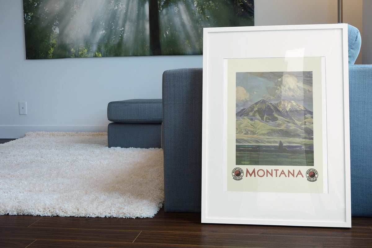 Montana Northern Pacific poster leaning beside a blue sofa