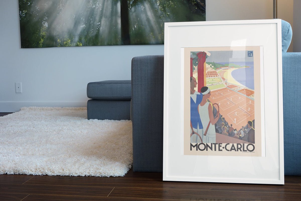 Monte-Carlo Tennis poster leaning beside a blue sofa