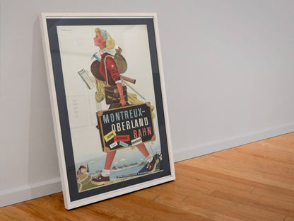 Montreux Oberland Bahn poster in a white frame leaning against a wall