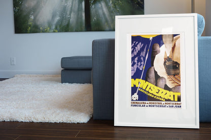 Montserrat Barcelona poster leaning beside a blue sofa
