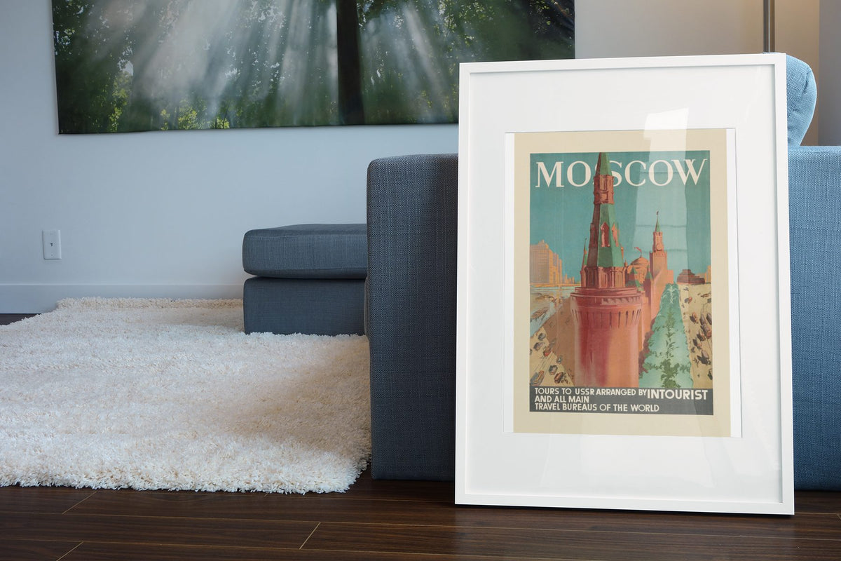 Moscow Intourist poster leaning beside a blue sofa