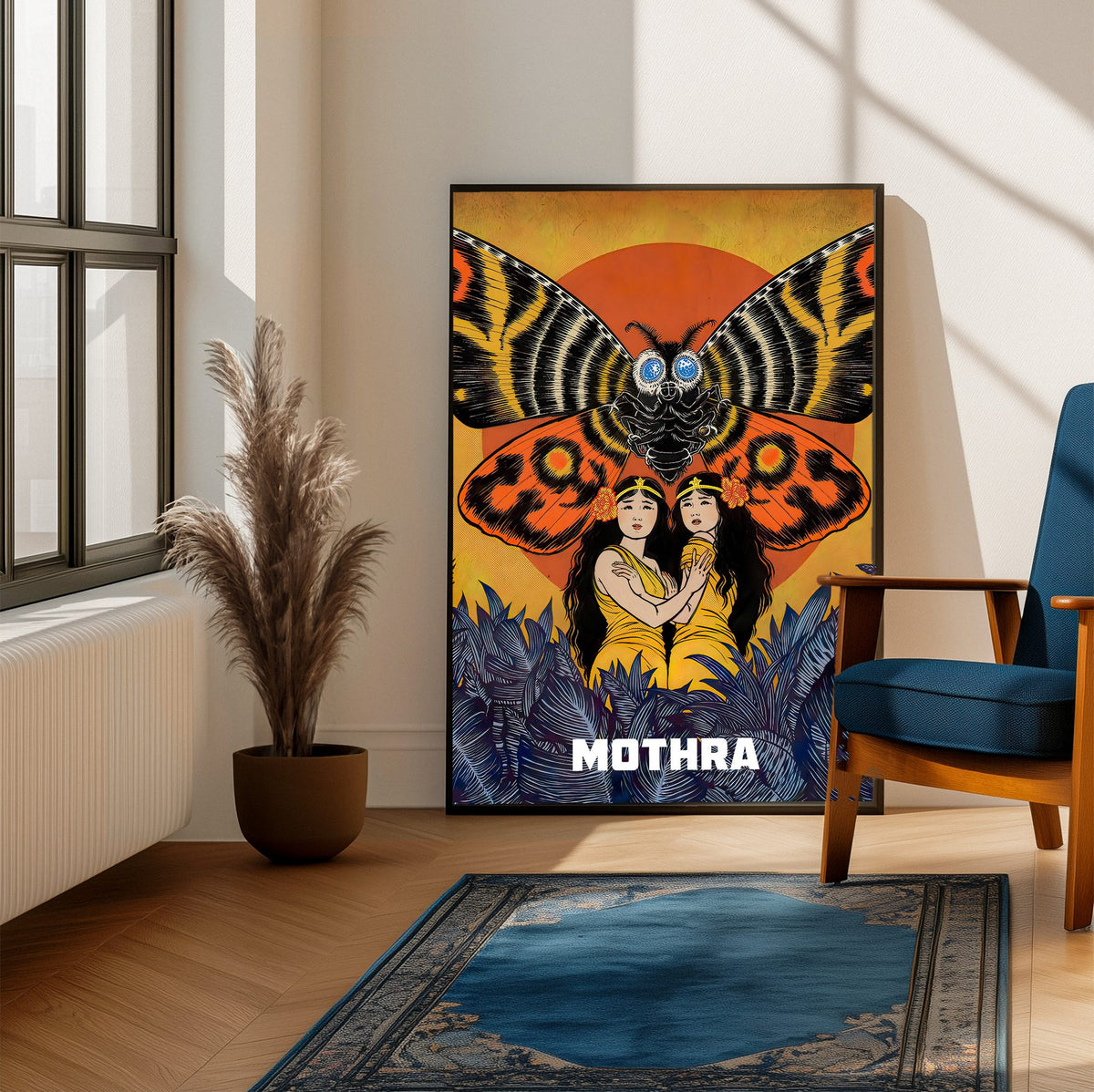 Mothra (1961) Movie Illustrated Art poster framed beside a blue armchair in a sunlit room