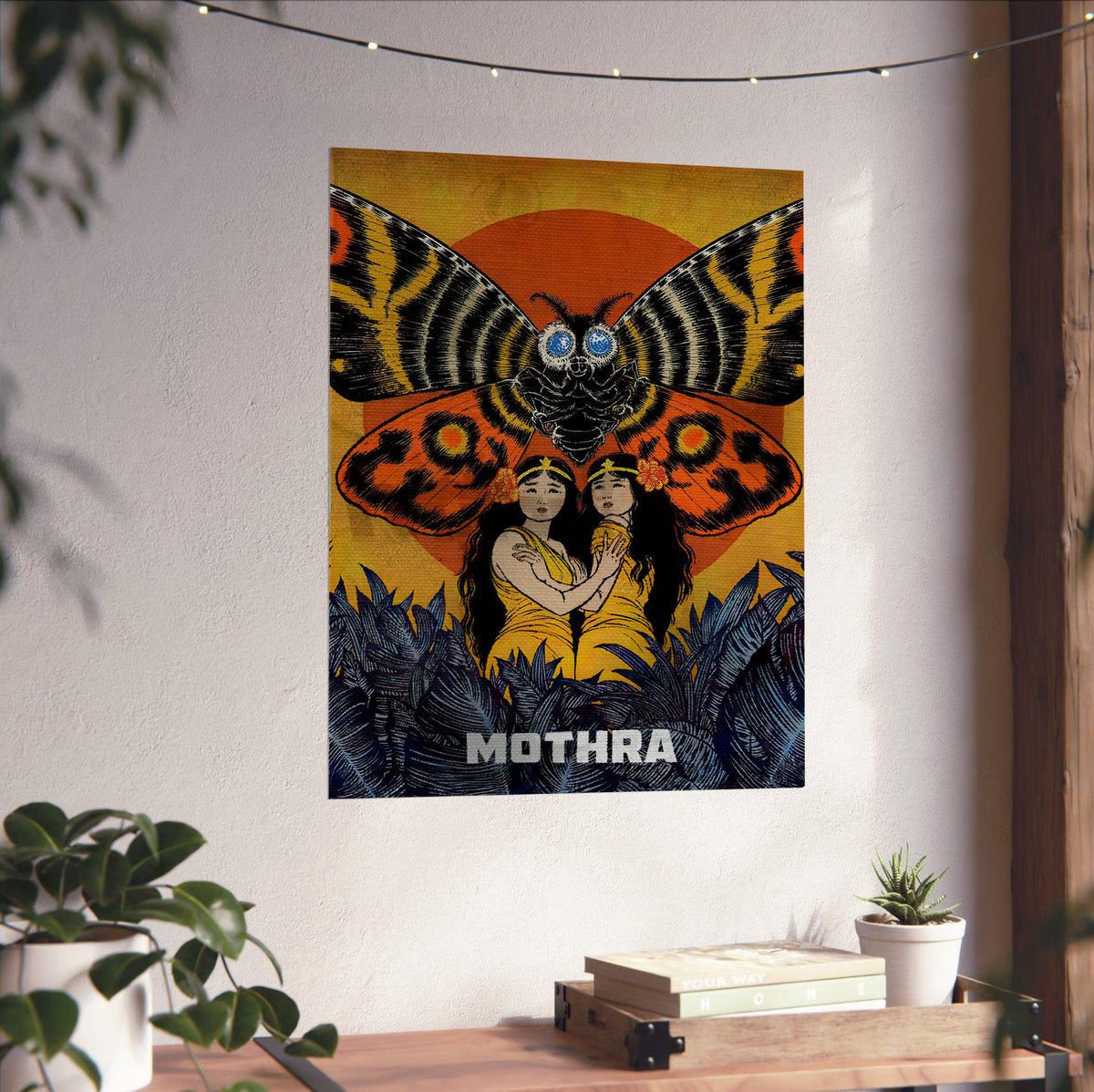Mothra (1961) Movie Illustrated Art poster unframed on a white wall above a desk