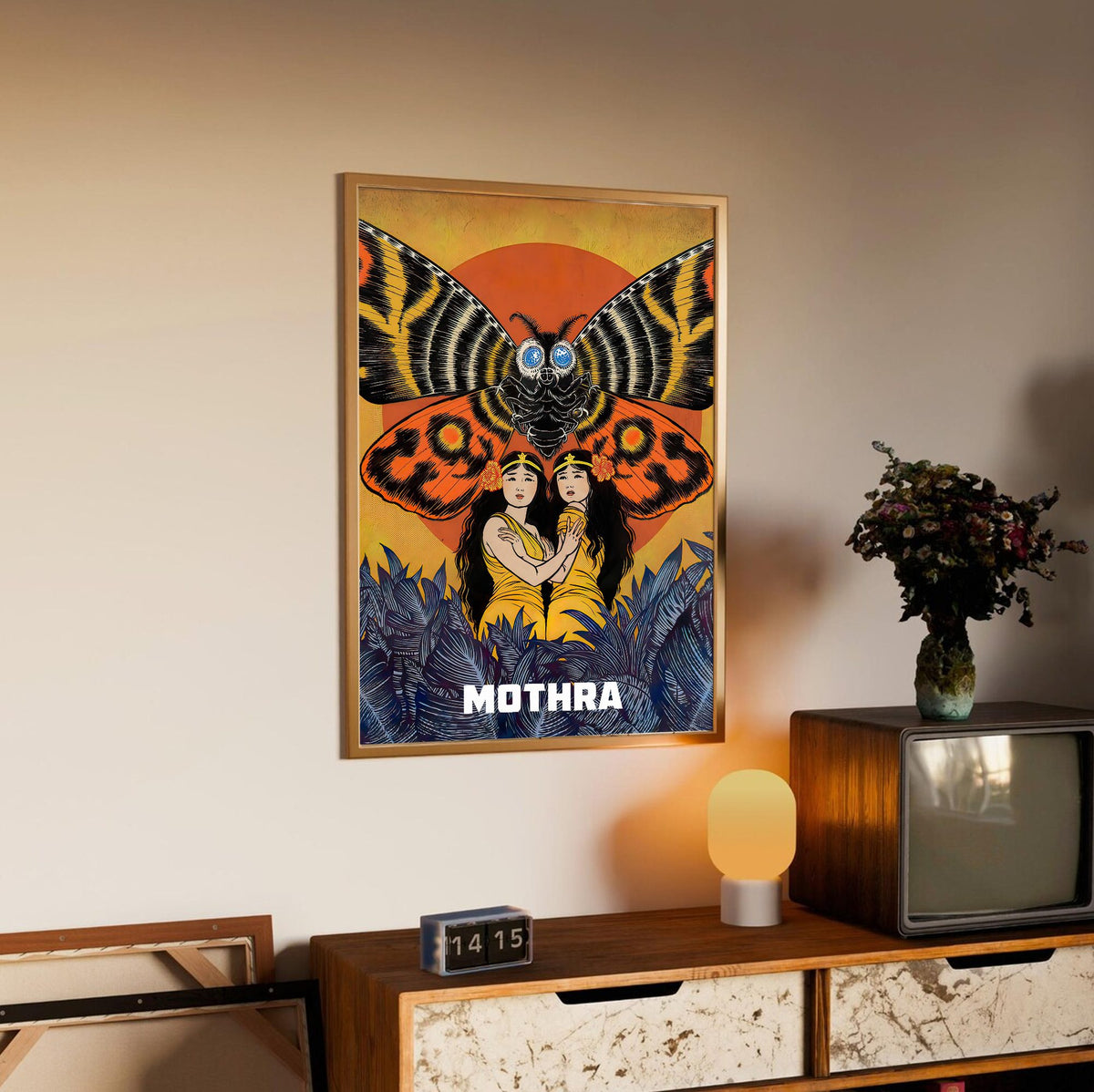 Mothra (1961) Movie Illustrated Art poster in an oak frame above a sideboard