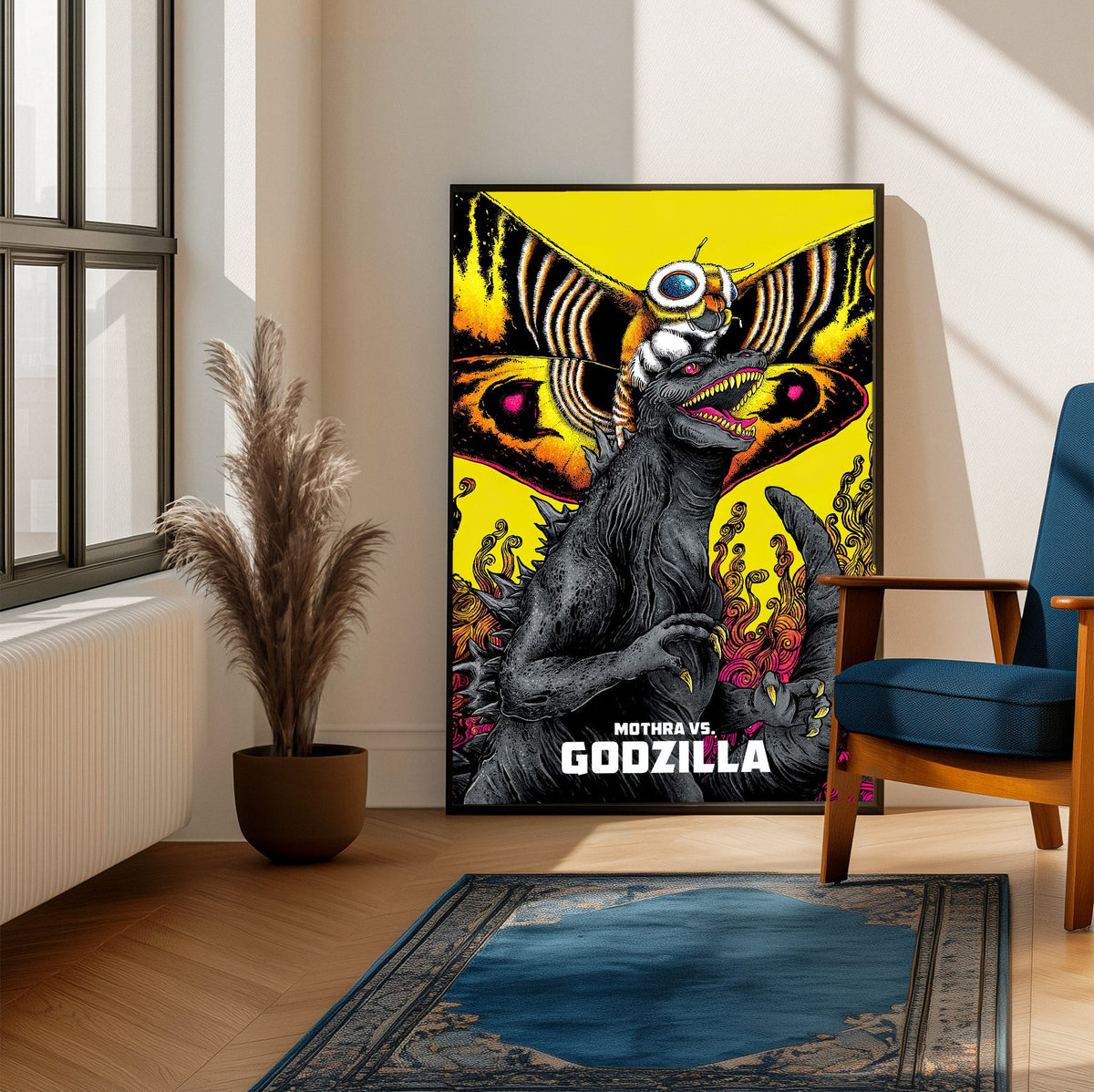 Mothra vs. Godzilla (1964) Movie Illustrated Art poster framed beside a blue armchair in a sunlit room