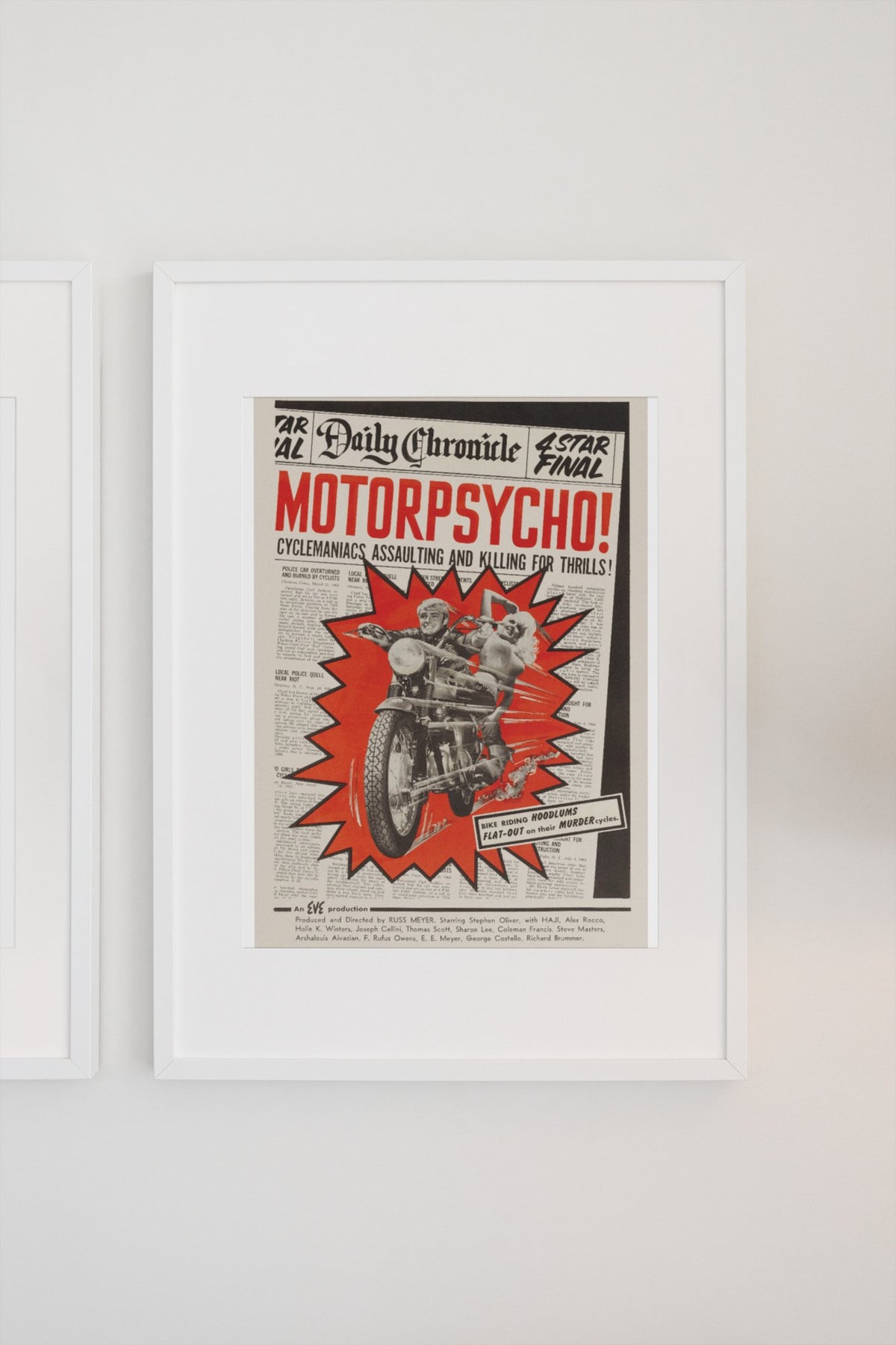 Motorpsycho! 1965 poster in a white frame on a light wall