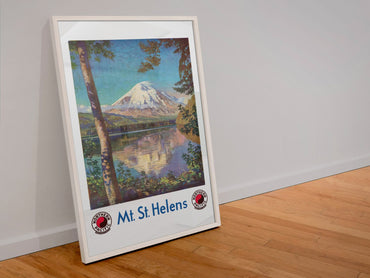 Mt St Helens Northern Pacific poster in a white frame leaning against a wall