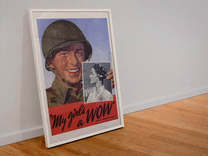 My Girls a WOW Woman Ordnance Worker poster in a white frame leaning against a wall