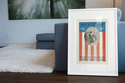 My Soldier — Third Liberty Loan poster leaning beside a blue sofa