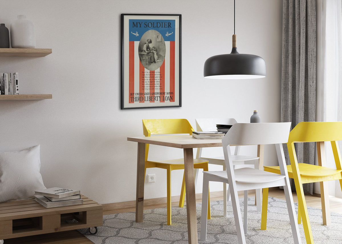 My Soldier — Third Liberty Loan poster framed above a dining table