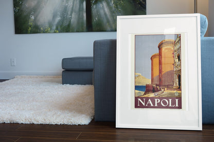 Napoli Naples poster leaning beside a blue sofa
