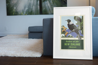 New Zealand Tui Bird poster leaning beside a blue sofa