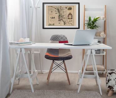 New England 1635 Map print framed above a white desk in a home office