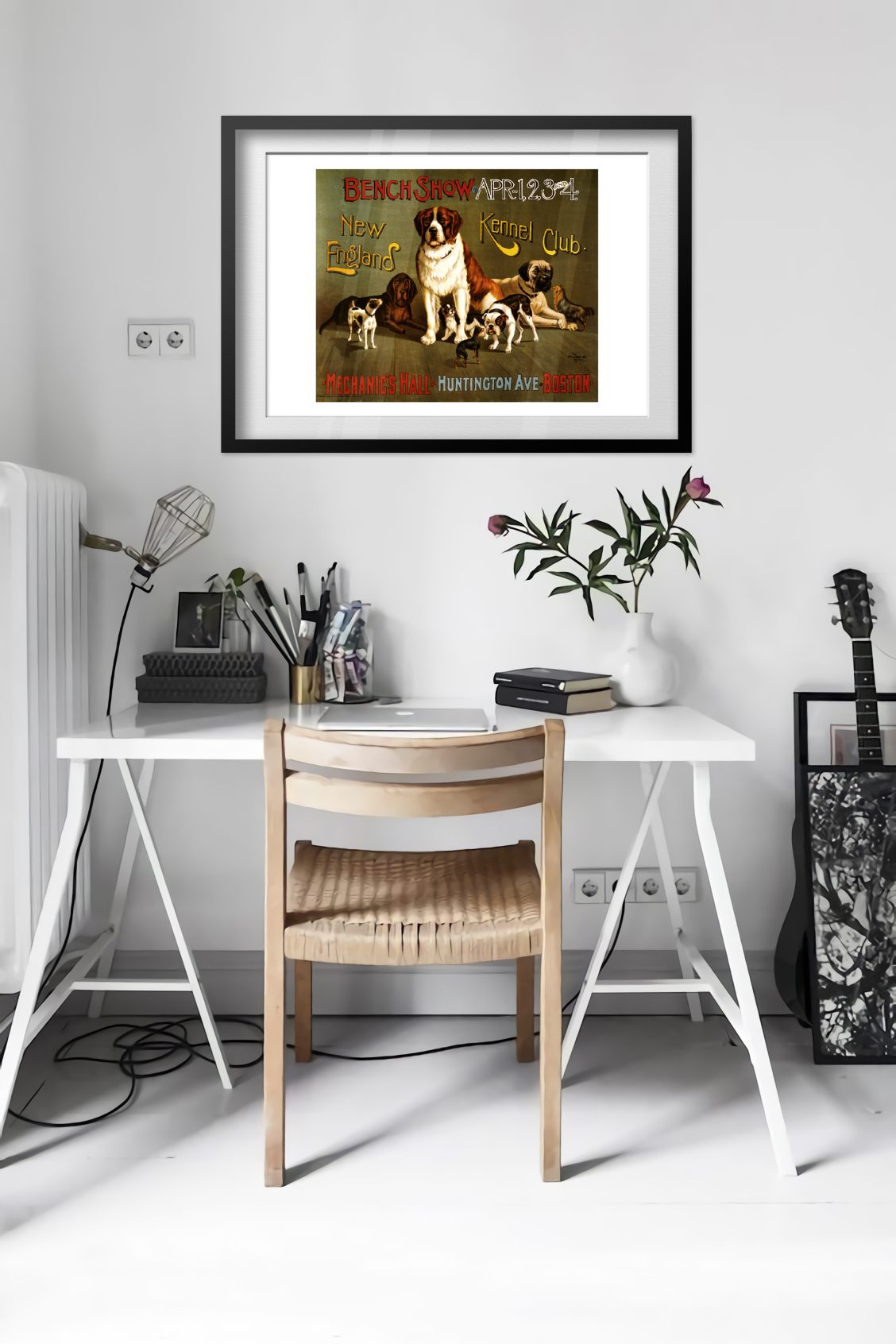 New England Kennel Club Bench Show poster framed above a desk in a bright white room