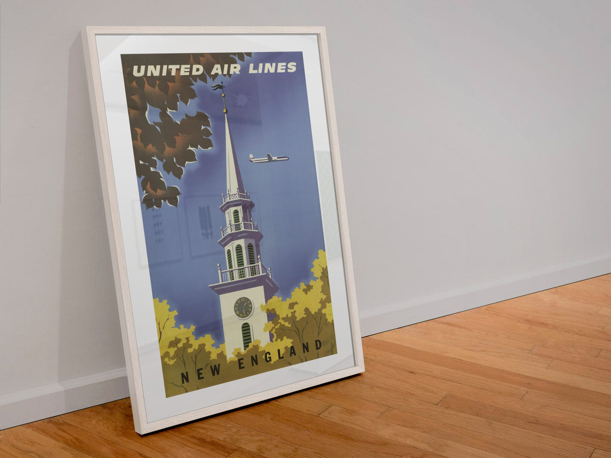 New England United Air Lines poster in a white frame leaning against a wall