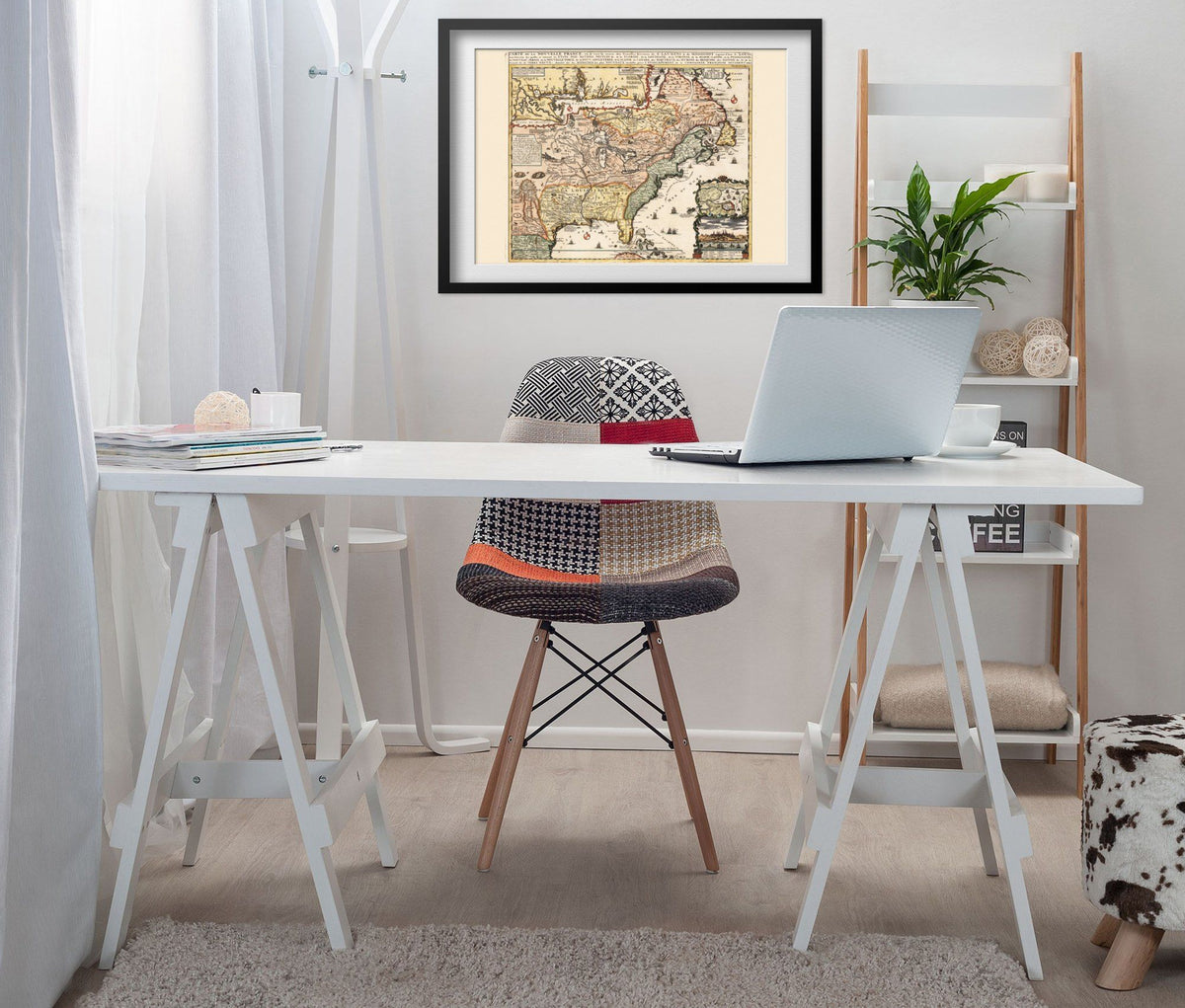 New France 1718 Map print framed above a white desk in a home office