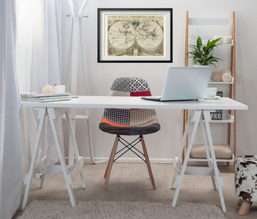 New Map of the Terraqueous Globe 1700 framed above a white desk in a home office