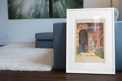 New Orleans Go Greyhound poster leaning beside a blue sofa