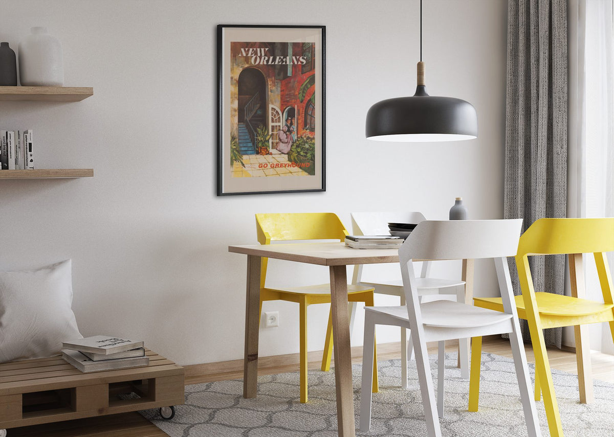 New Orleans Go Greyhound poster framed above a dining table