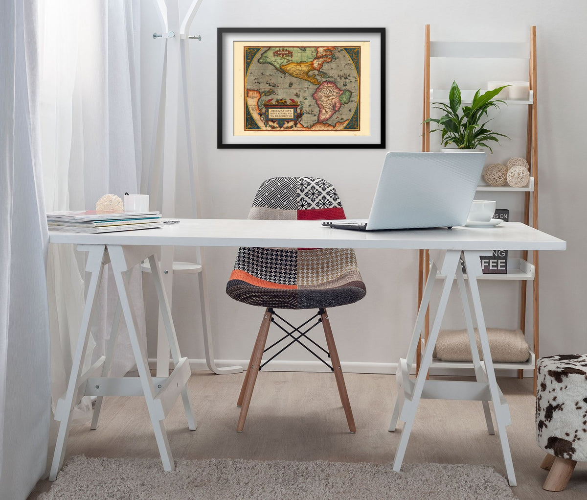 New World 1598 Map framed above a white desk in a home office