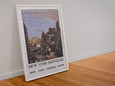 New York Leslie Ragan poster in a white frame leaning against a wall