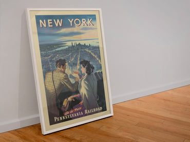 New York Pennsylvania Railroad poster in a white frame leaning against a wall