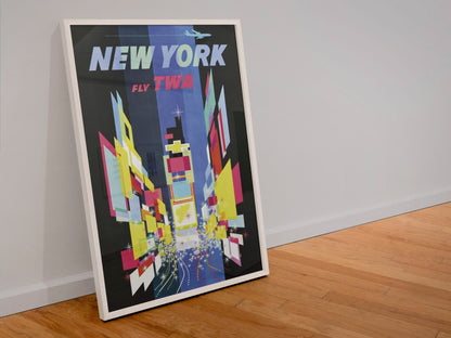 New York Times Square Fly TWA poster in a white frame leaning against a wall