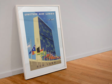 New York United Nations United Air Lines poster in a white frame leaning against a wall