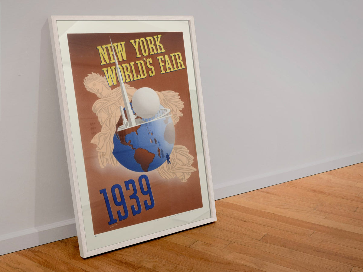 New York Worlds Fair 1939 Globe poster in a white frame leaning against a wall