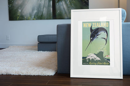 New Zealand Black Marlin poster leaning beside a blue sofa