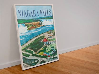 Niagara Falls Go Greyhound poster in a white frame leaning against a wall