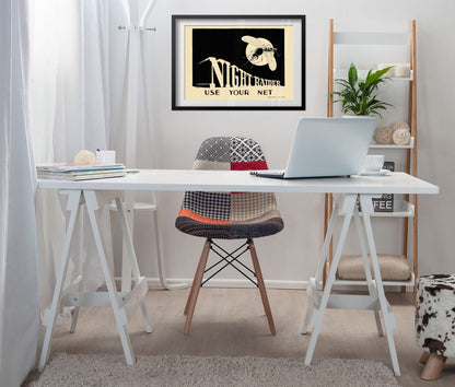 Night Raider — Use Your Net poster framed above a white desk in a home office
