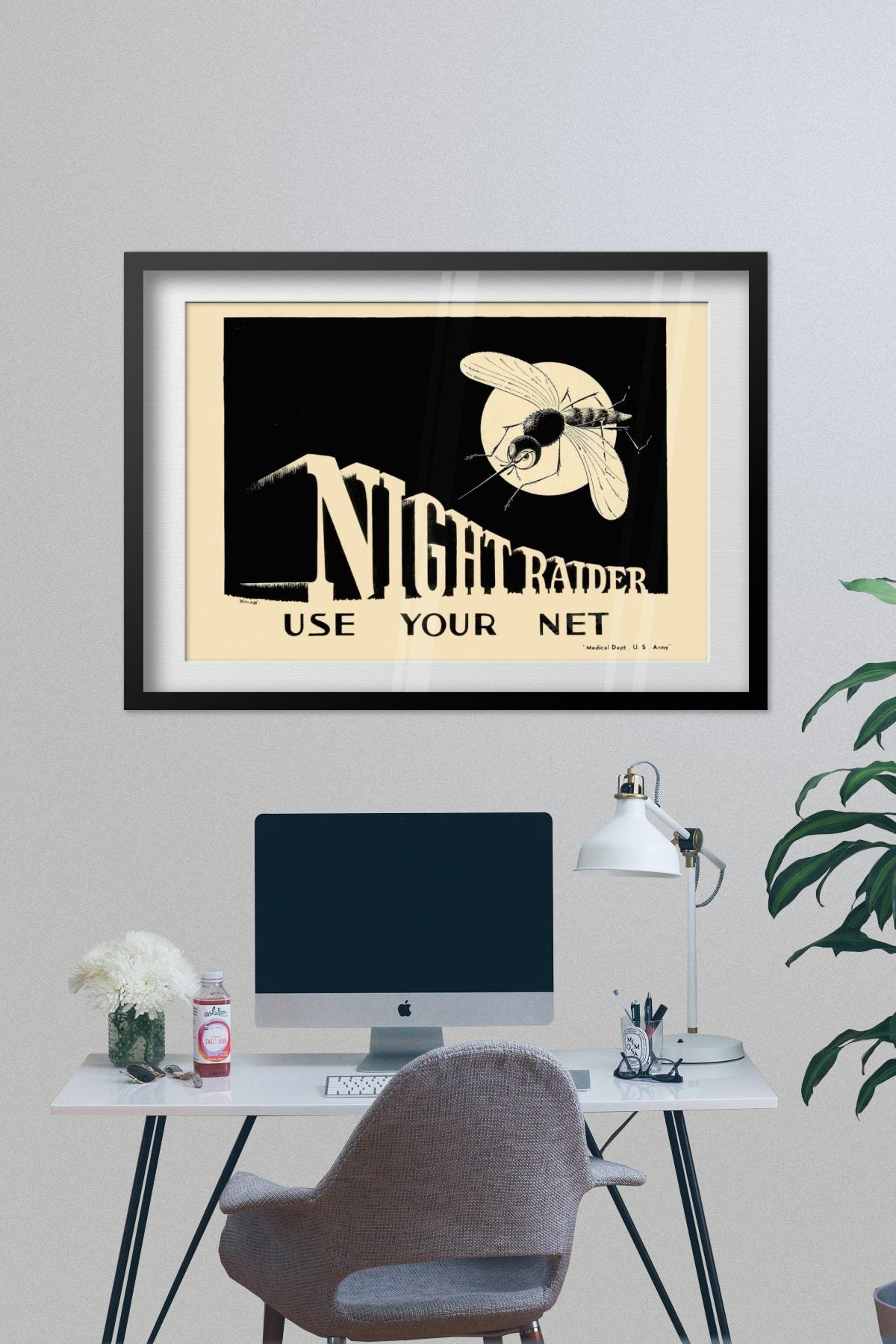 Night Raider — Use Your Net poster framed on a grey wall above a desk