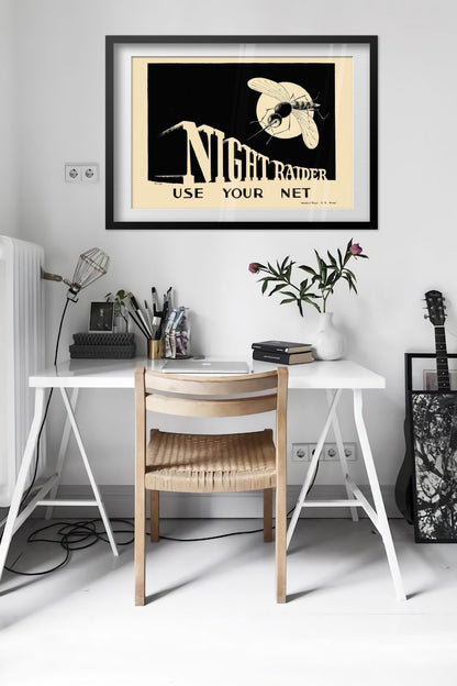 Night Raider — Use Your Net poster framed above a desk in a bright white room
