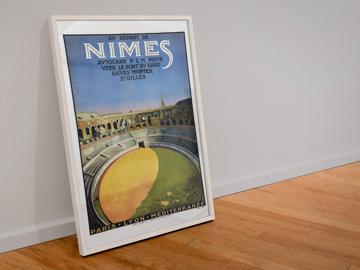 Nimes Roman Amphitheater poster in a white frame leaning against a wall