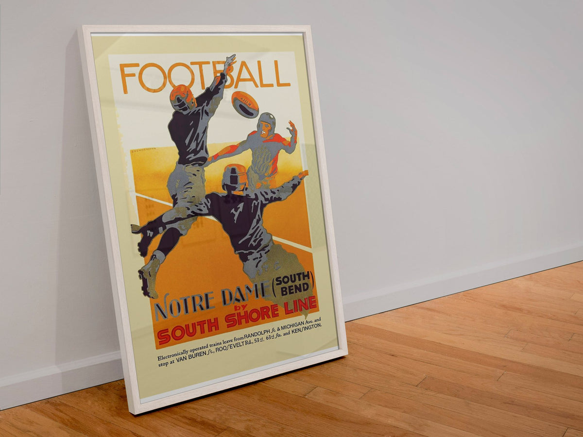 Notre Dame Football South Shore Line poster in a white frame leaning against a wall