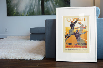 Notre Dame Football South Shore Line poster leaning beside a blue sofa