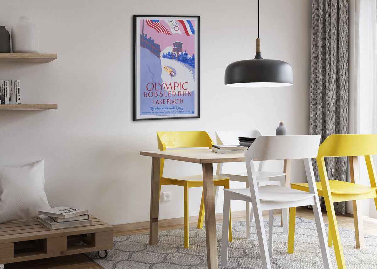 Olympic Bobsled Run Lake Placid 1938 poster framed above a dining table