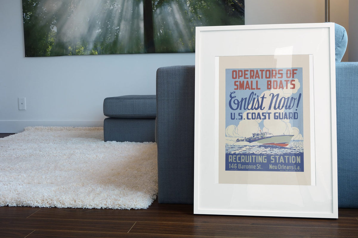 Operators of Small Boats US Coast Guard poster leaning beside a blue sofa