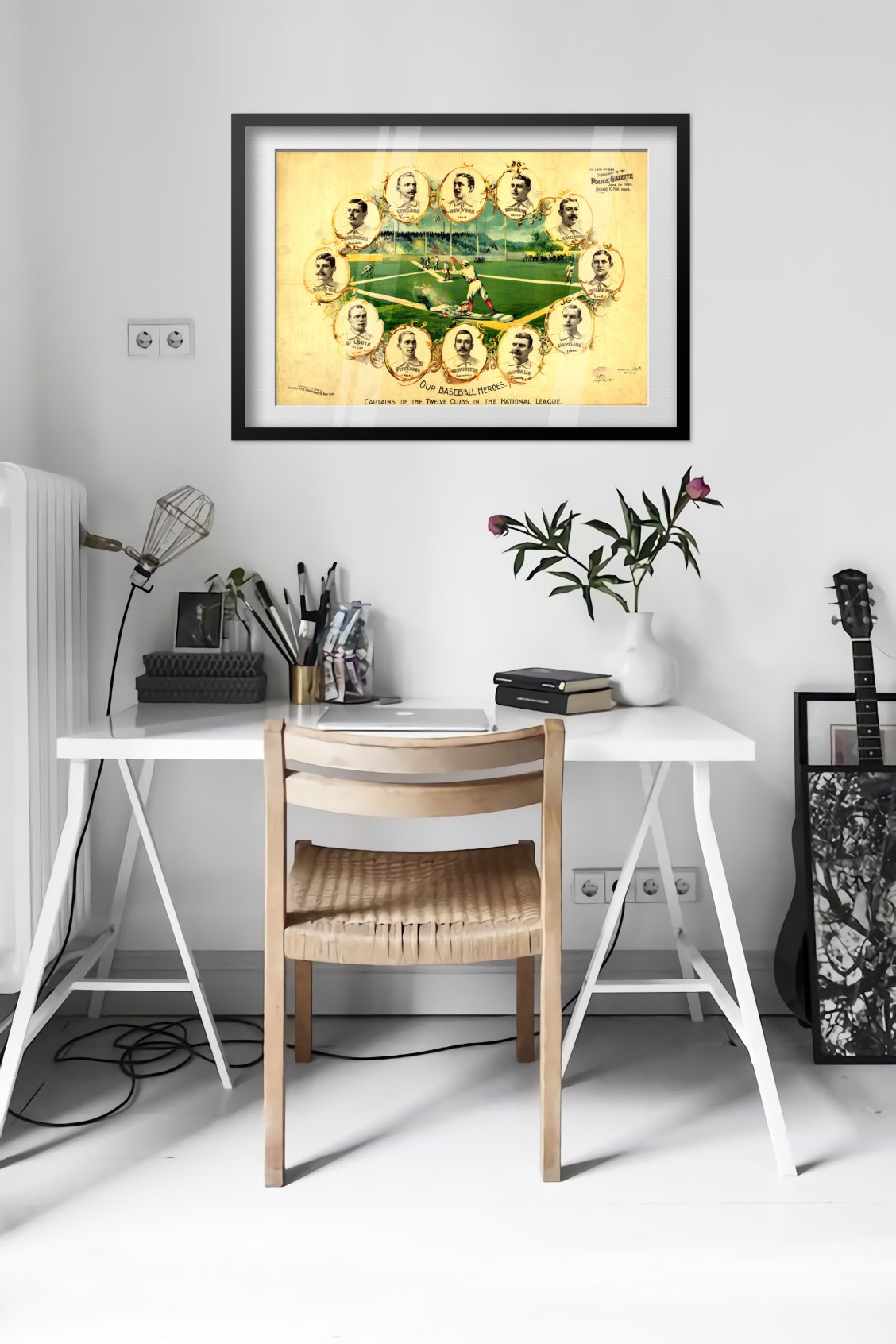 Our Baseball Heroes 1890s poster framed above a desk in a bright white room
