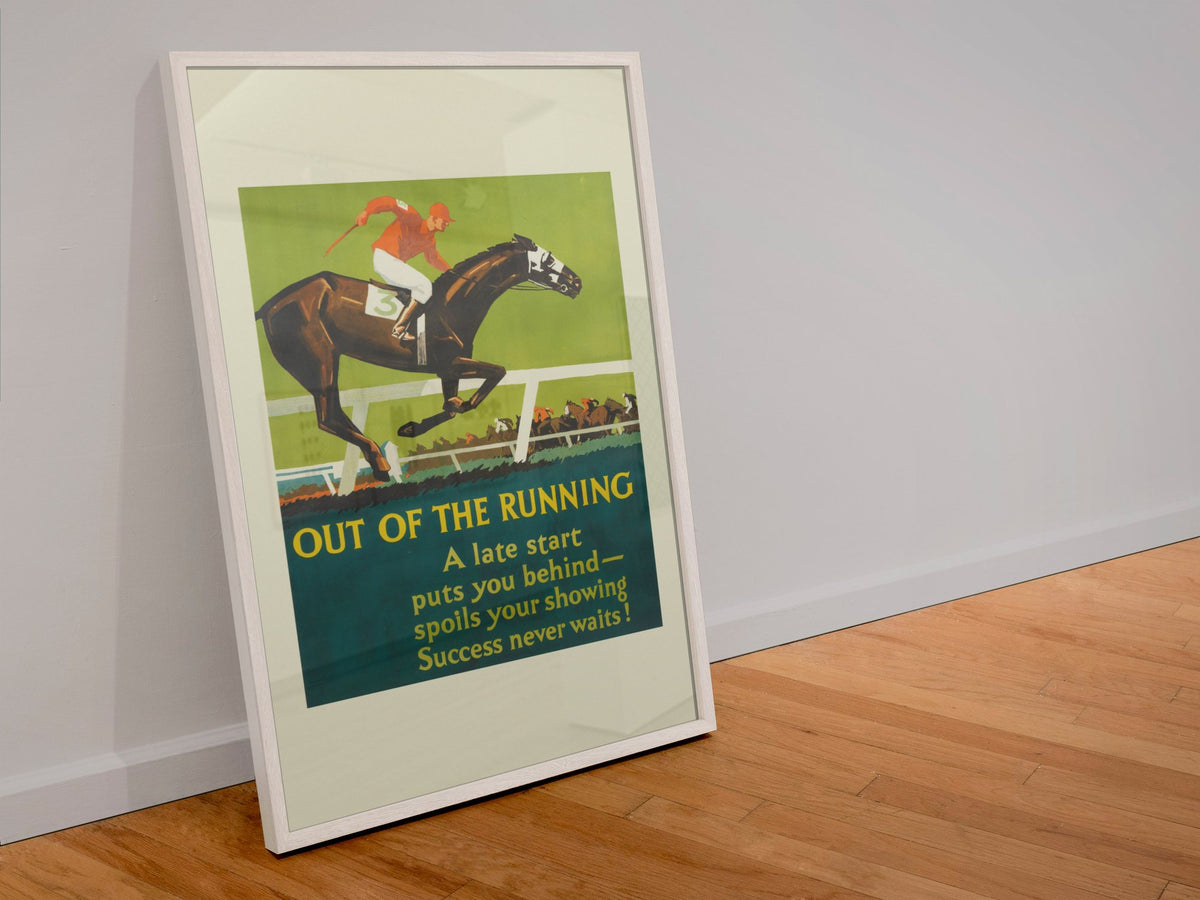 Out of the Running poster in a white frame leaning against a wall
