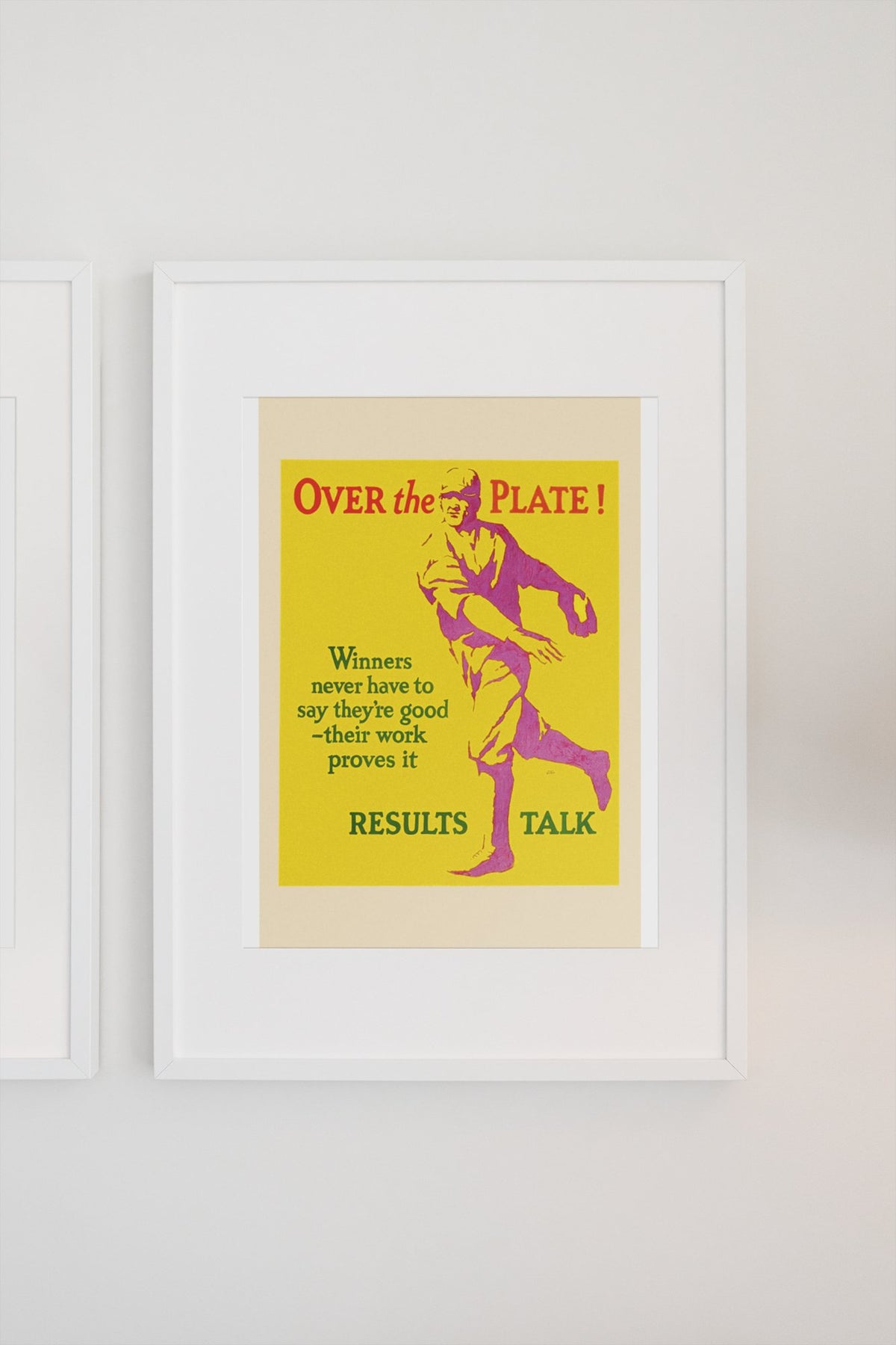 Over the Plate poster in a white frame on a light wall