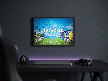 Palworld Key Art poster in a black frame above a gaming desk